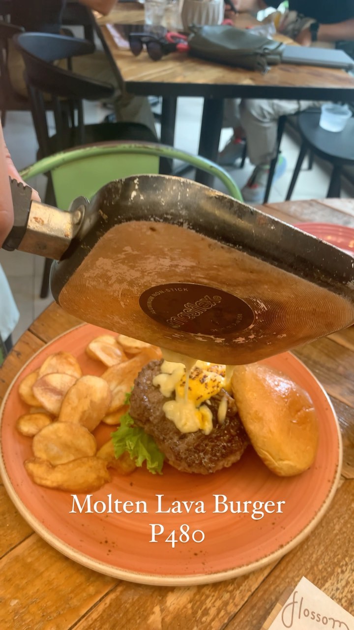 Molten Lava Burger at Flossom — lava cheese poured over Angus beef patty